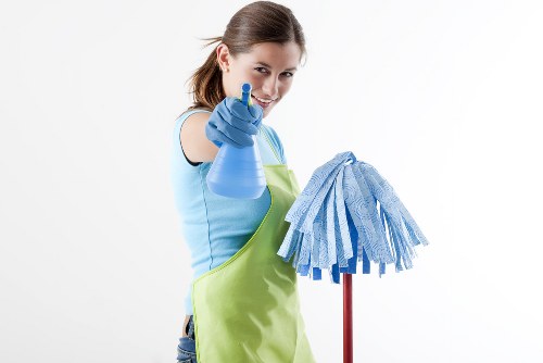 Commercial cleaning team preparing an office space in E14