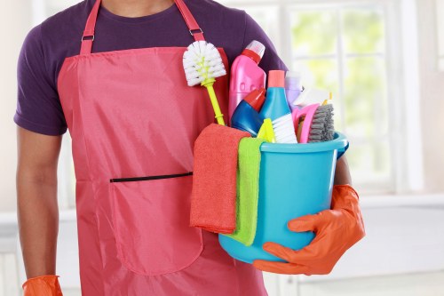 Professional sofa cleaning service for a modern E14 apartment interior