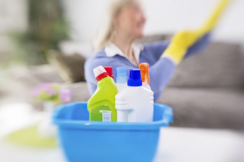 Local cleaner treating fabric stains on a chair in E14